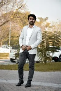 a-man-standing-in-suit