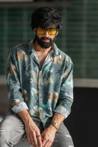 a-man-sitting-with-sunglass